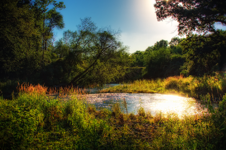 I was out the other afternoon with a new friend of mine discovering some uncharted territory for me.  After walking down some trails in my area we discovered this creek and I happened to get there just at the right time of day to capture this photo.  It was a pretty neat place under a large bridge with lots of graffiti art in the area which was originally what I was looking for.  I was much more pleased with this photo.
